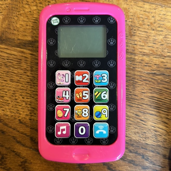 Multi-pack take along toys. Includes remote, phone and misc. book type toy. - Picture 8 of 11